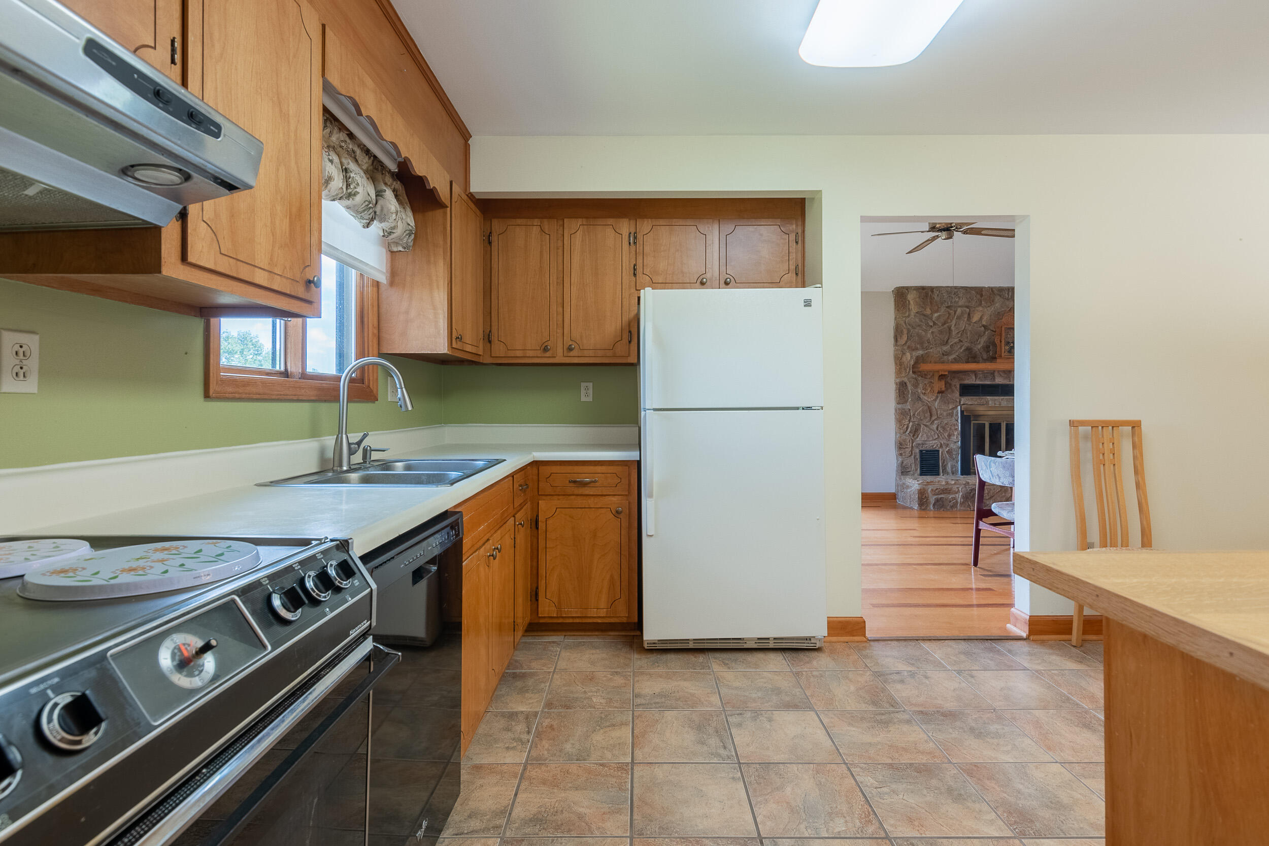 995 White Oak Grove Road Northeast Riner, VA 24149 - Photo 14 of 70 a kitchen with a stove a refrigerator and a sink