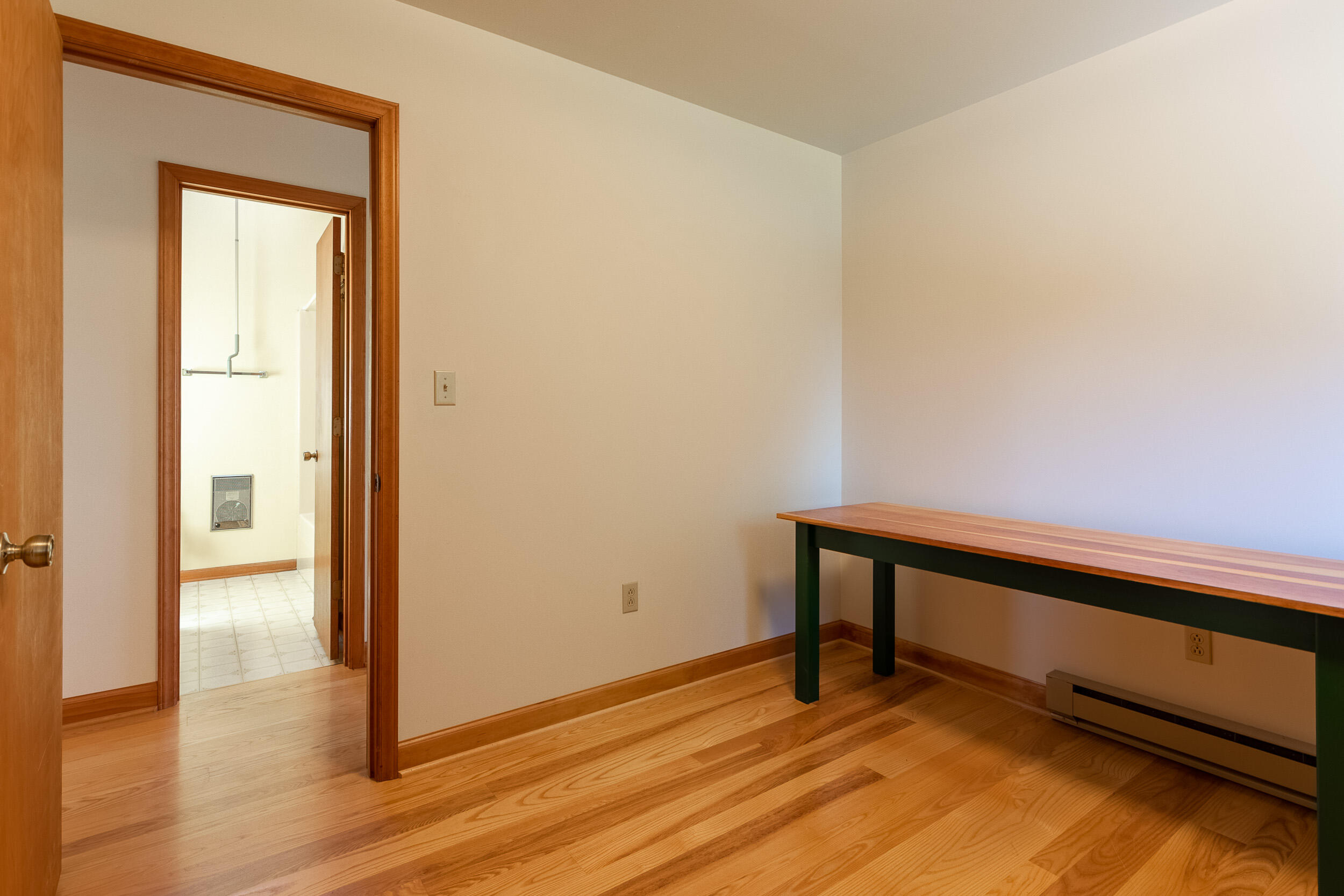 995 White Oak Grove Road Northeast Riner, VA 24149 - Photo 22 of 70 a view of an empty room with wooden floor and a window