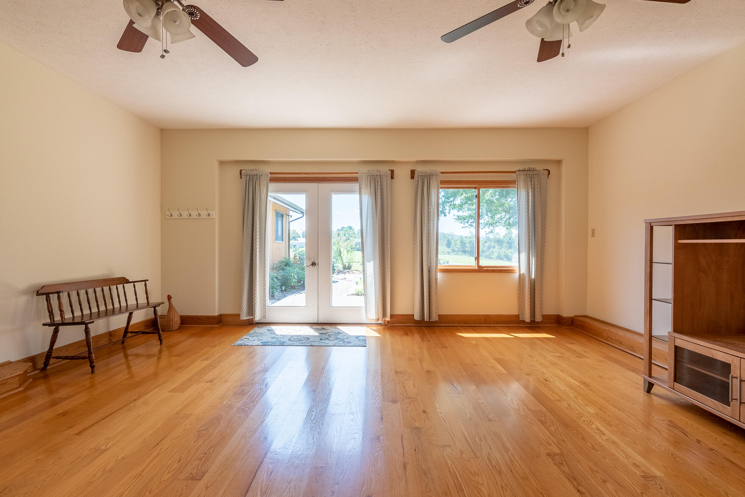 995 White Oak Grove Road Northeast Riner, VA 24149 - Photo 32 of 70 a view of an empty room with a window and wooden floor