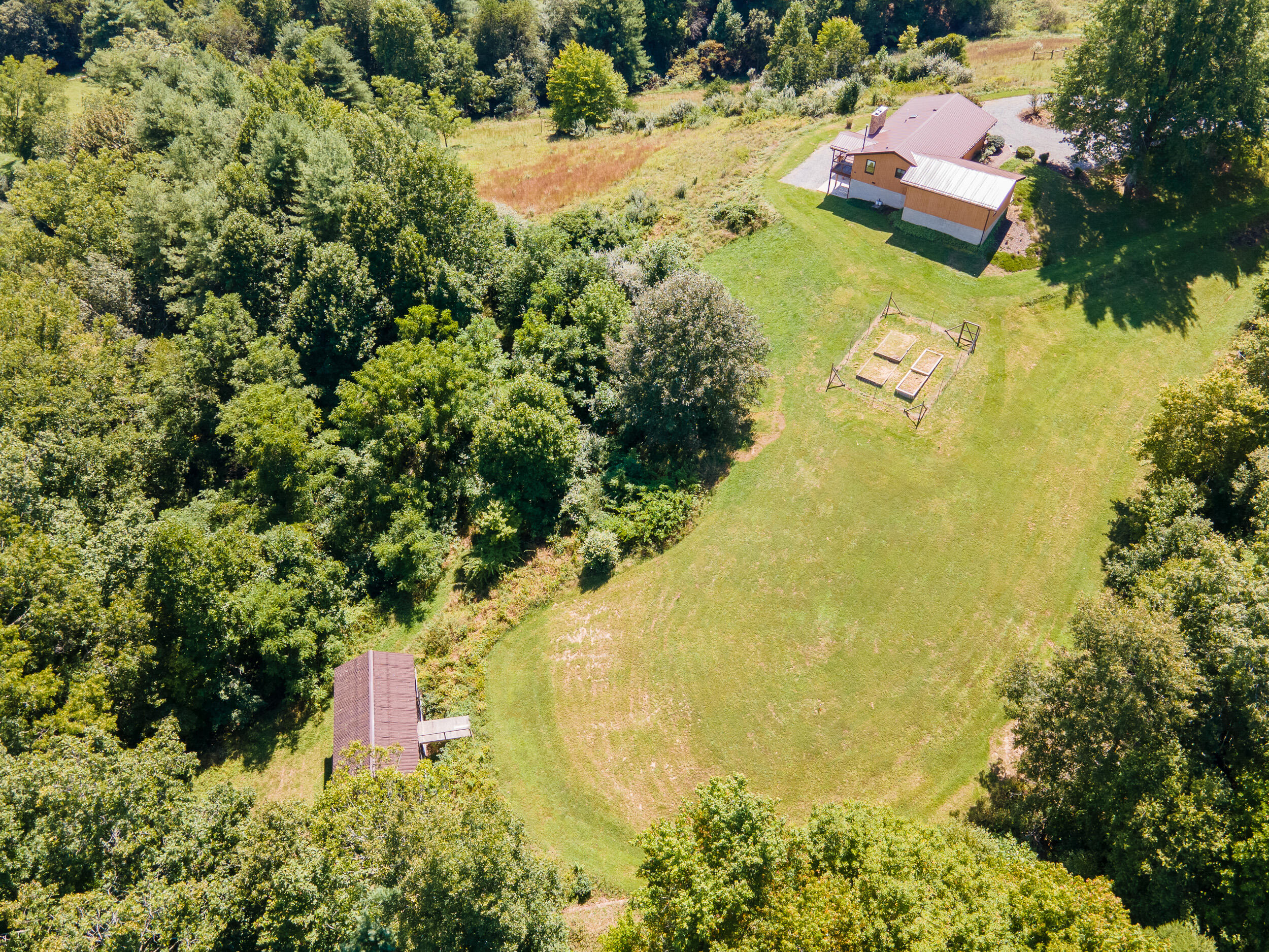 995 White Oak Grove Road Northeast Riner, VA 24149 - Photo 5 of 70 an aerial view of residential houses with outdoor space