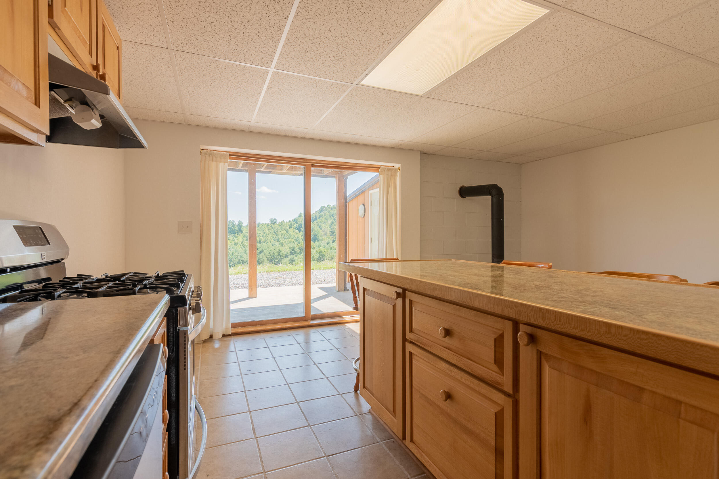 995 White Oak Grove Road Northeast Riner, VA 24149 - Photo 43 of 70 a kitchen with a sink a stove and a window