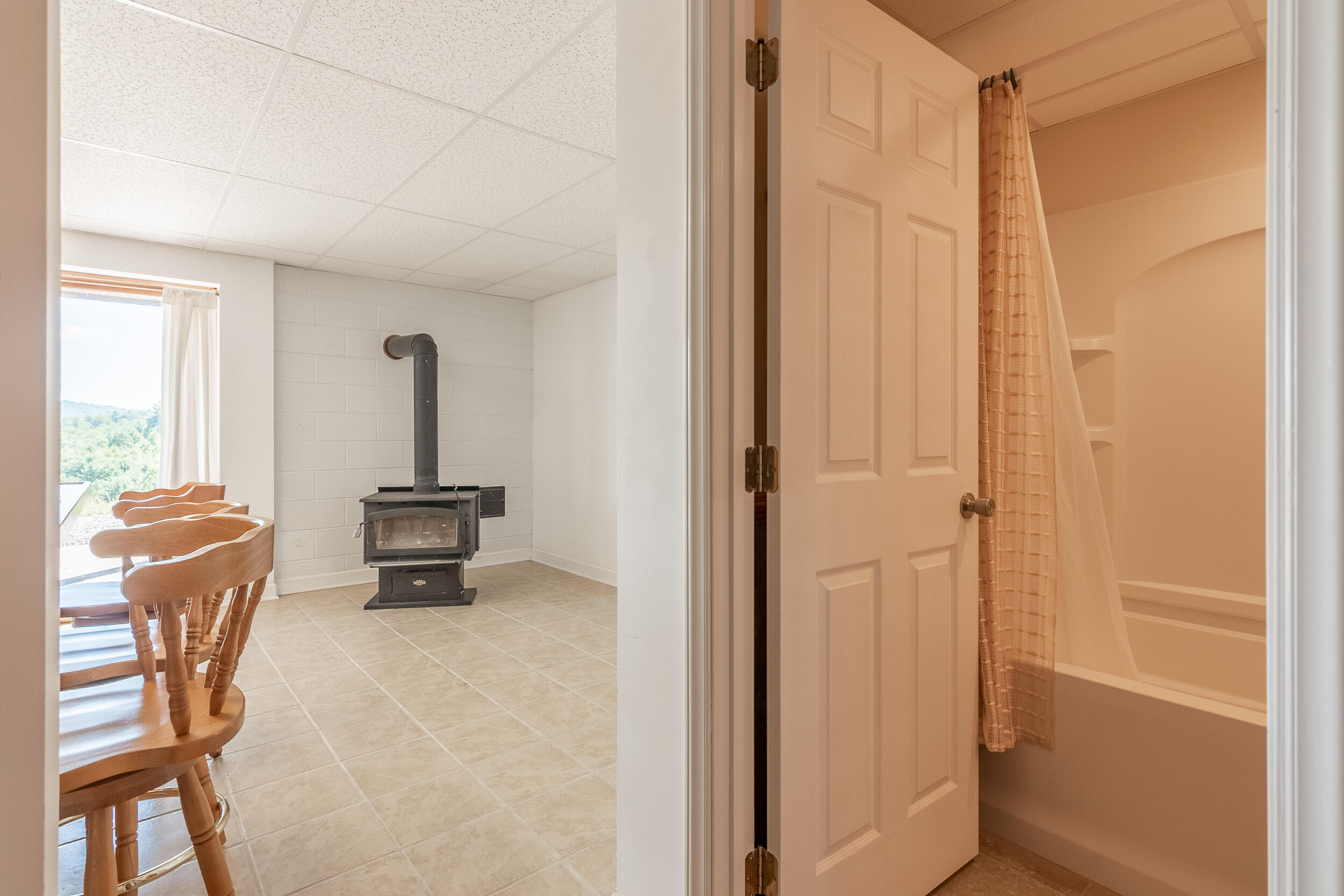 995 White Oak Grove Road Northeast Riner, VA 24149 - Photo 44 of 70 a view of a hallway with furniture and a window