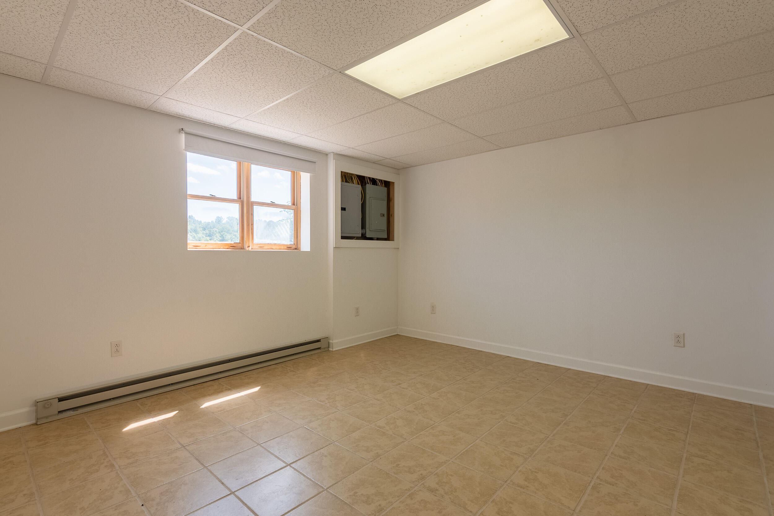 995 White Oak Grove Road Northeast Riner, VA 24149 - Photo 52 of 70 an empty room with windows