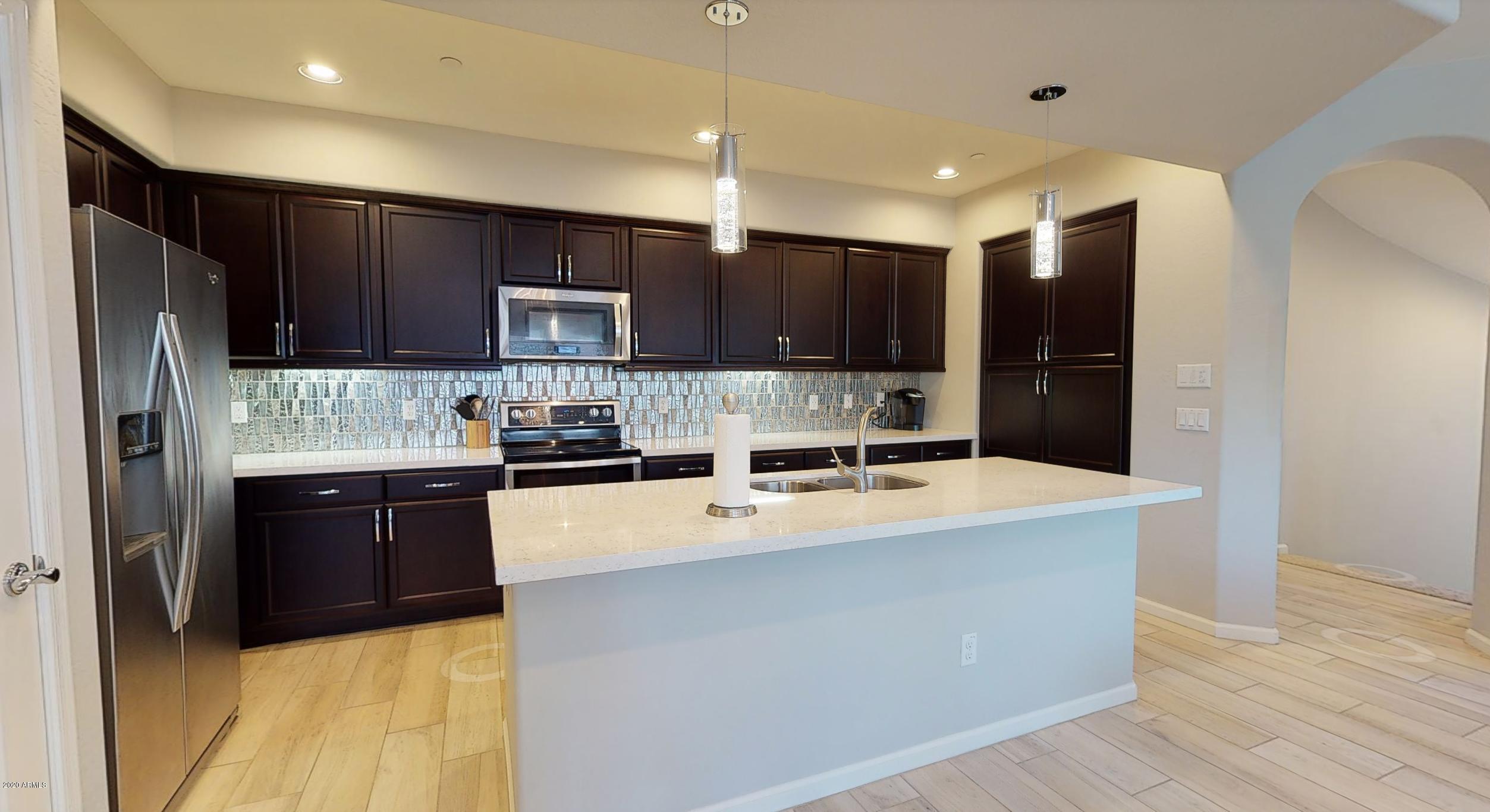 3935 East Rough Rider Road, Unit 1267 Phoenix, AZ 85050 - Photo 24 of 34 Kitchen