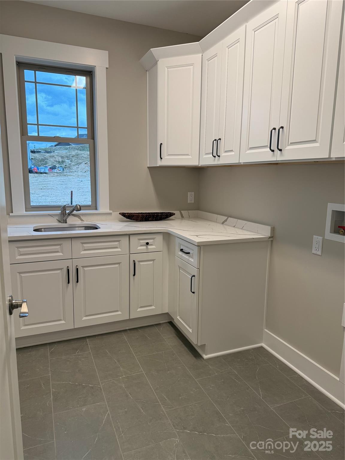 20 Craftsman Overlook Ridge Arden, NC 28704 - Photo 14 of 16 a kitchen with white cabinets stainless steel appliances and sink