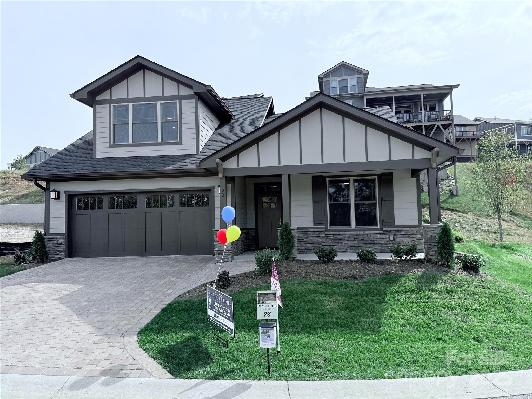20 Craftsman Overlook Ridge Arden, NC 28704 - Photo 2 of 16 a front view of a house with a yard and outdoor seating