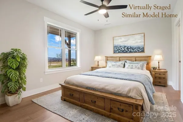 a bedroom with a bed and a potted plant