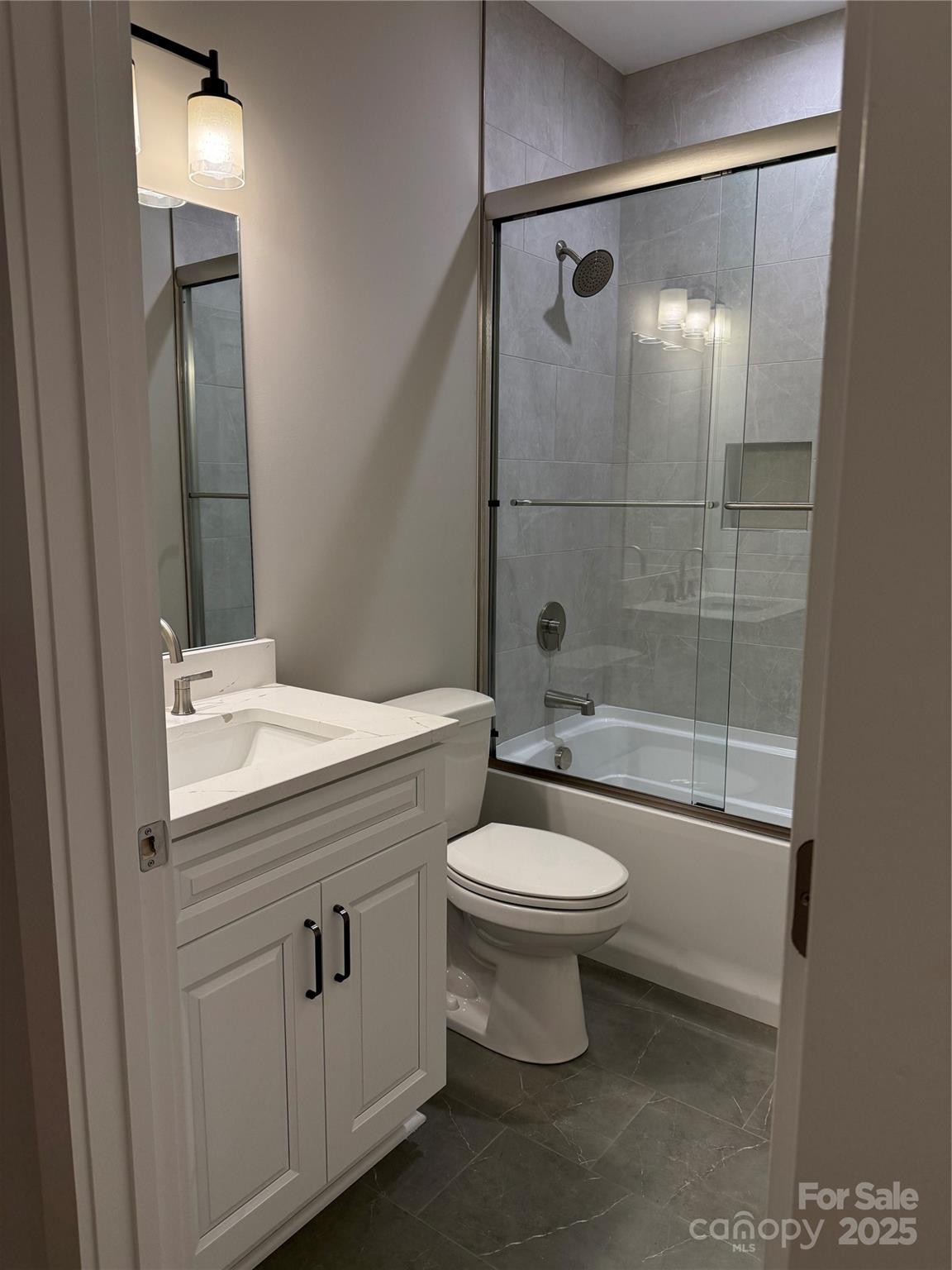 20 Craftsman Overlook Ridge Arden, NC 28704 - Photo 10 of 16 a bathroom with a toilet sink and shower