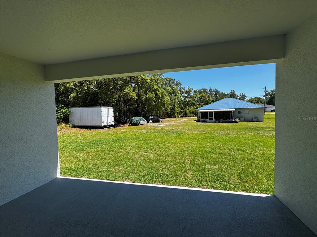 13101 Southwest 72nd Terrace Road Ocala, FL 34473 - Photo 18 of 18 a view of a lake from a yard