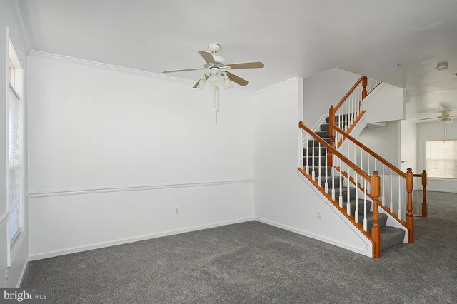 a view of empty room with stairs