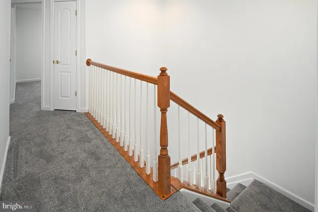 a view of a hallway with staircase