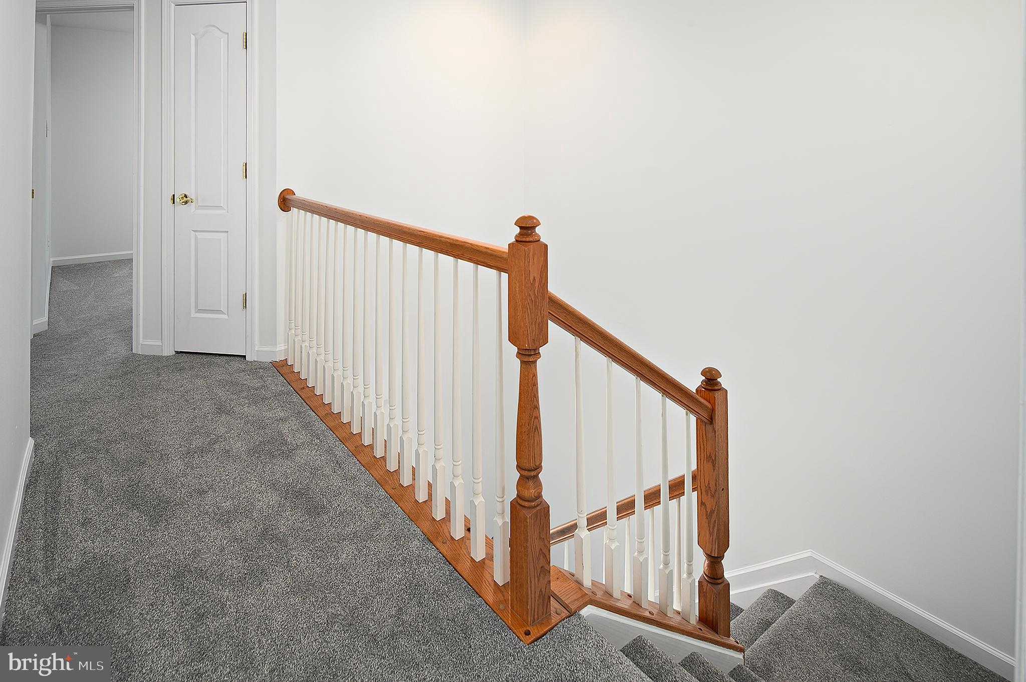 10229 Brighton Ridge Way, Unit 116 Columbia, MD 21044 - Photo 19 of 31 a view of a hallway with staircase