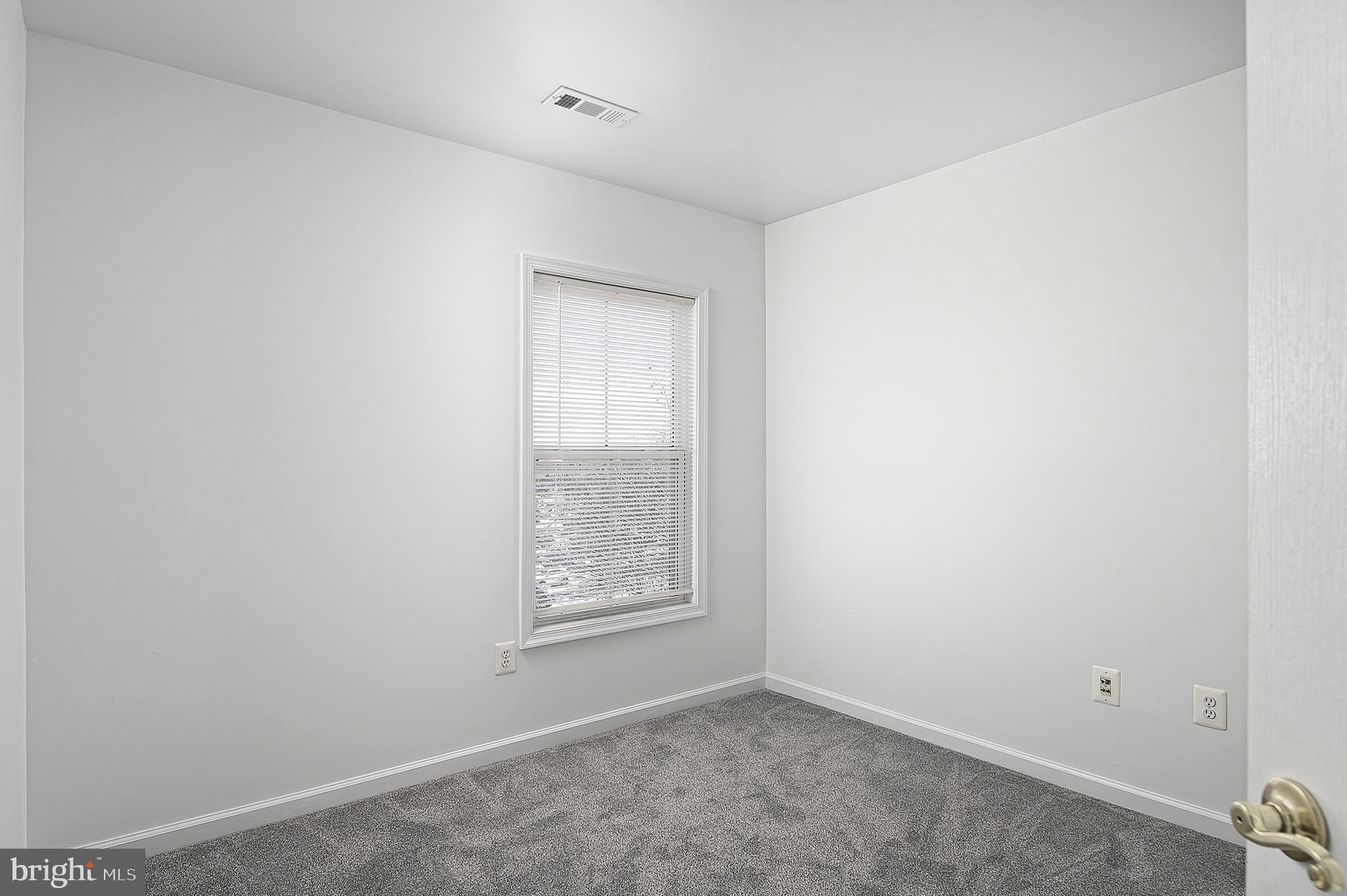 10229 Brighton Ridge Way, Unit 116 Columbia, MD 21044 - Photo 26 of 31 an empty room with windows