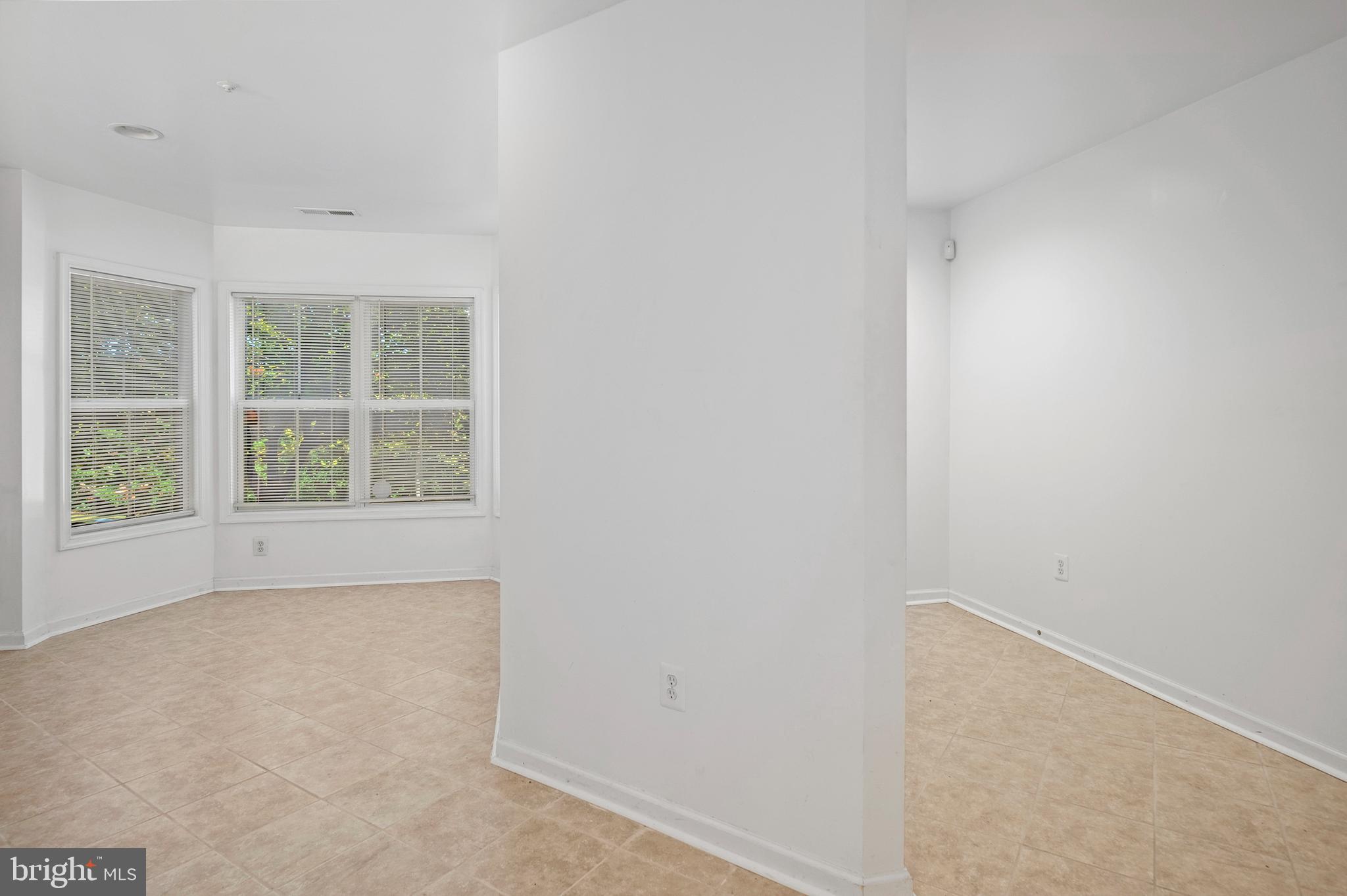 10229 Brighton Ridge Way, Unit 116 Columbia, MD 21044 - Photo 5 of 31 a view of an empty room with a window