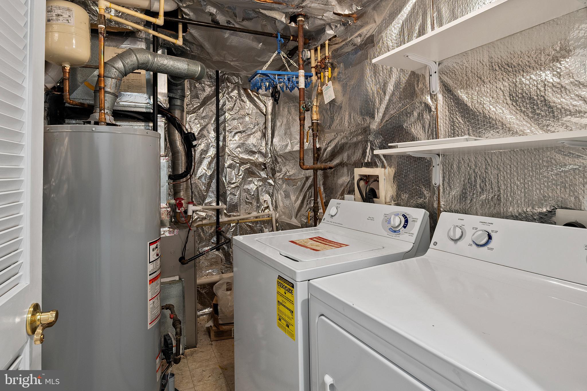 10229 Brighton Ridge Way, Unit 116 Columbia, MD 21044 - Photo 8 of 31 a utility room with dryer and washer