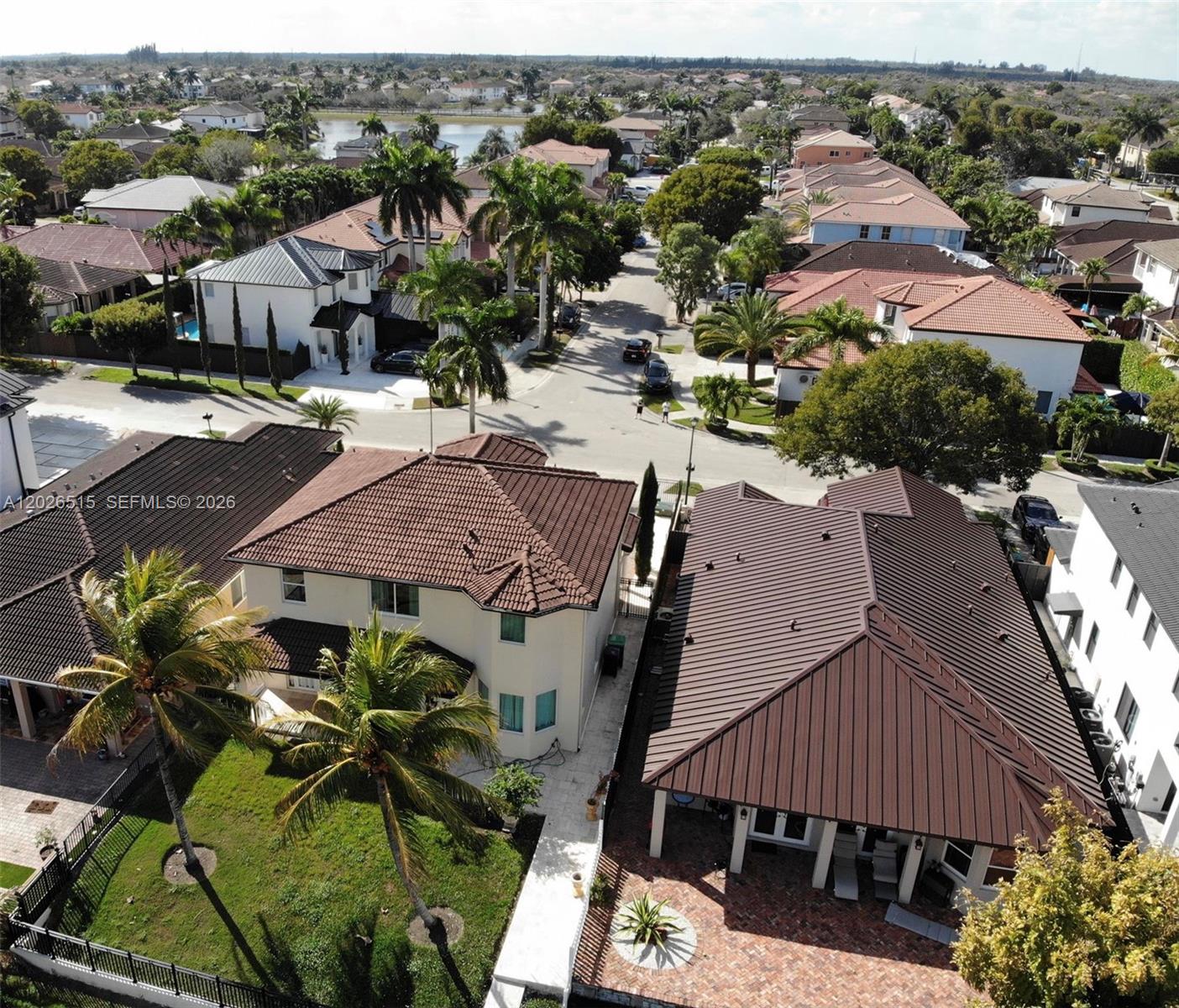 1065 Southwest 150th Place Miami, FL 33194 - Photo 13 of 14 an aerial view of multiple houses with yard
