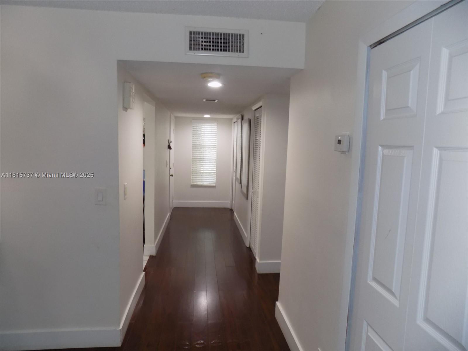 Bonaventure Weston, FL 33326 - Photo 12 of 16 a view of a hallway with wooden floor