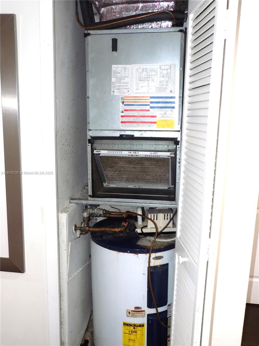 Bonaventure Weston, FL 33326 - Photo 14 of 16 a kitchen with a stove and a microwave