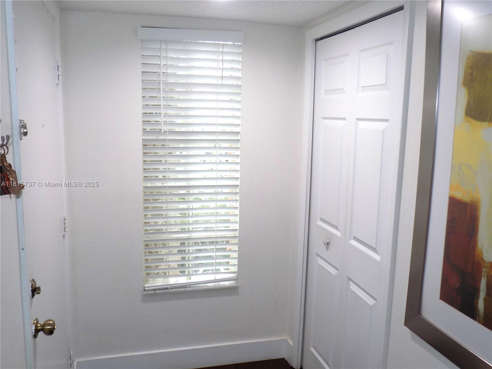 Bonaventure Weston, FL 33326 - Photo 15 of 16 a view of an empty room with closet and a window