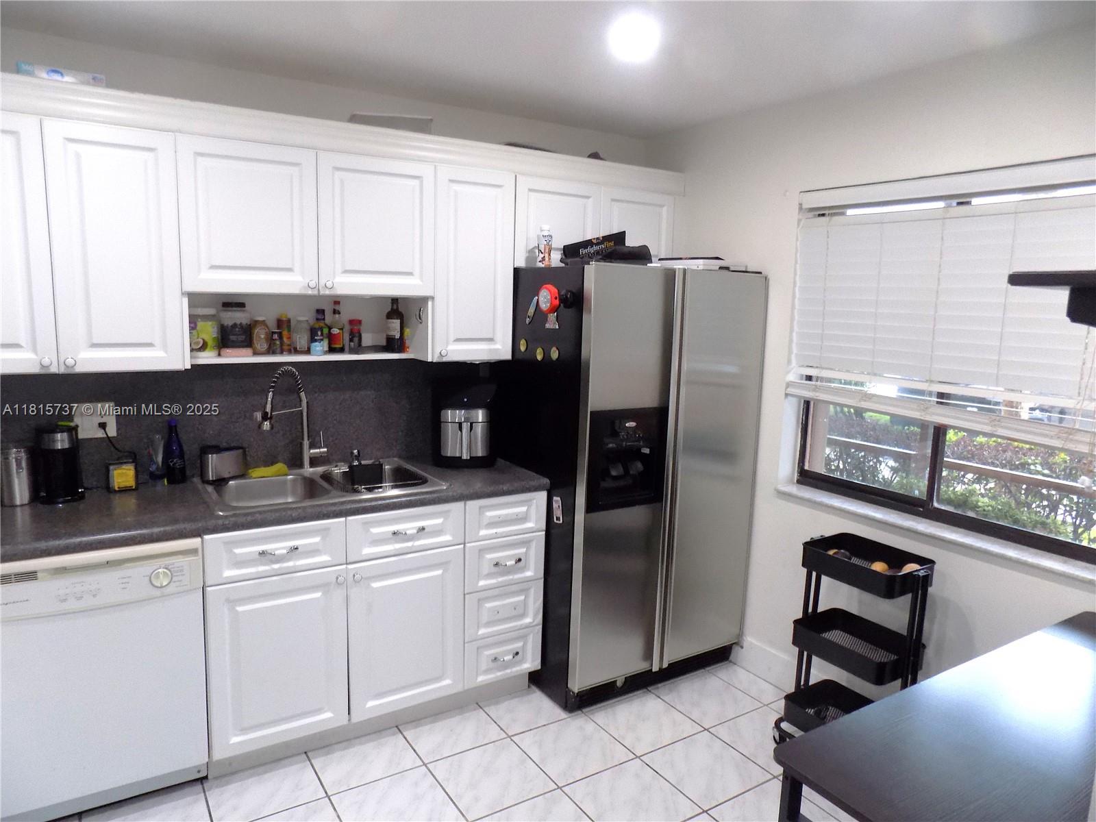 Bonaventure Weston, FL 33326 - Photo 2 of 16 a kitchen with stainless steel appliances a refrigerator sink and cabinets
