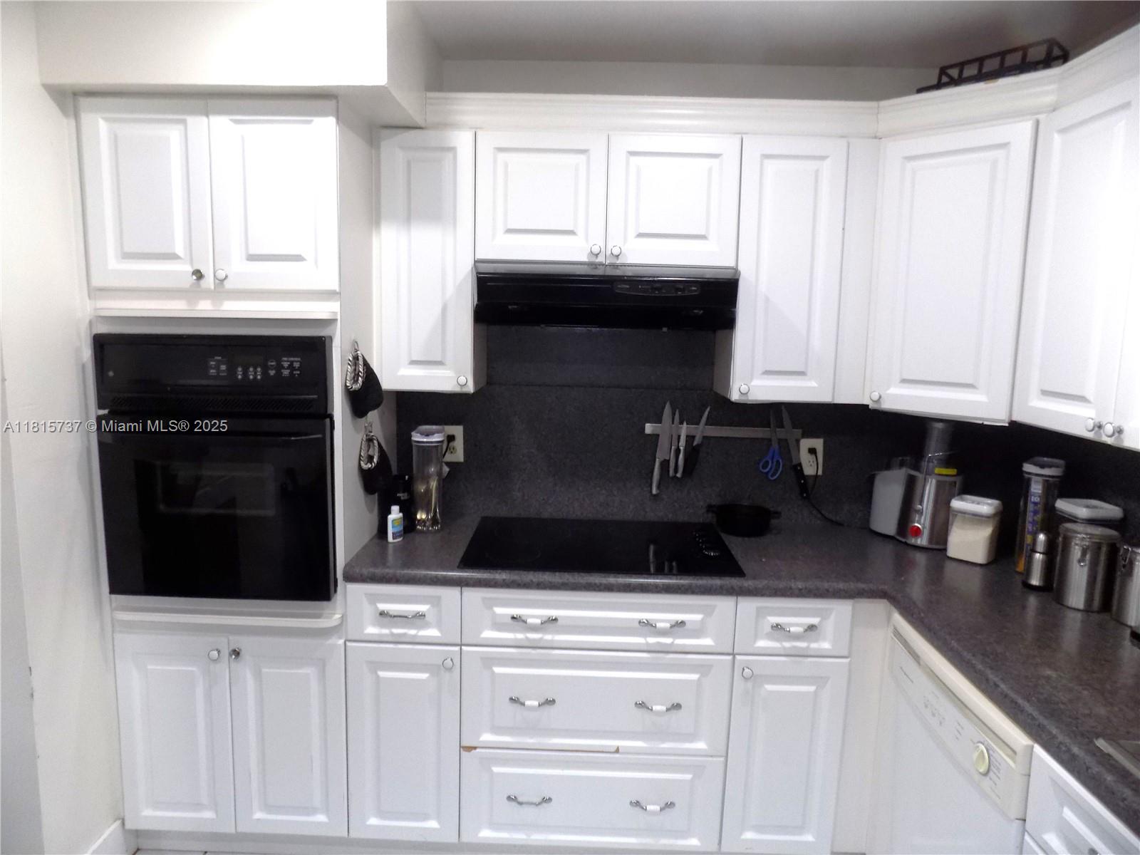 Bonaventure Weston, FL 33326 - Photo 3 of 16 a kitchen with a stove and cabinets