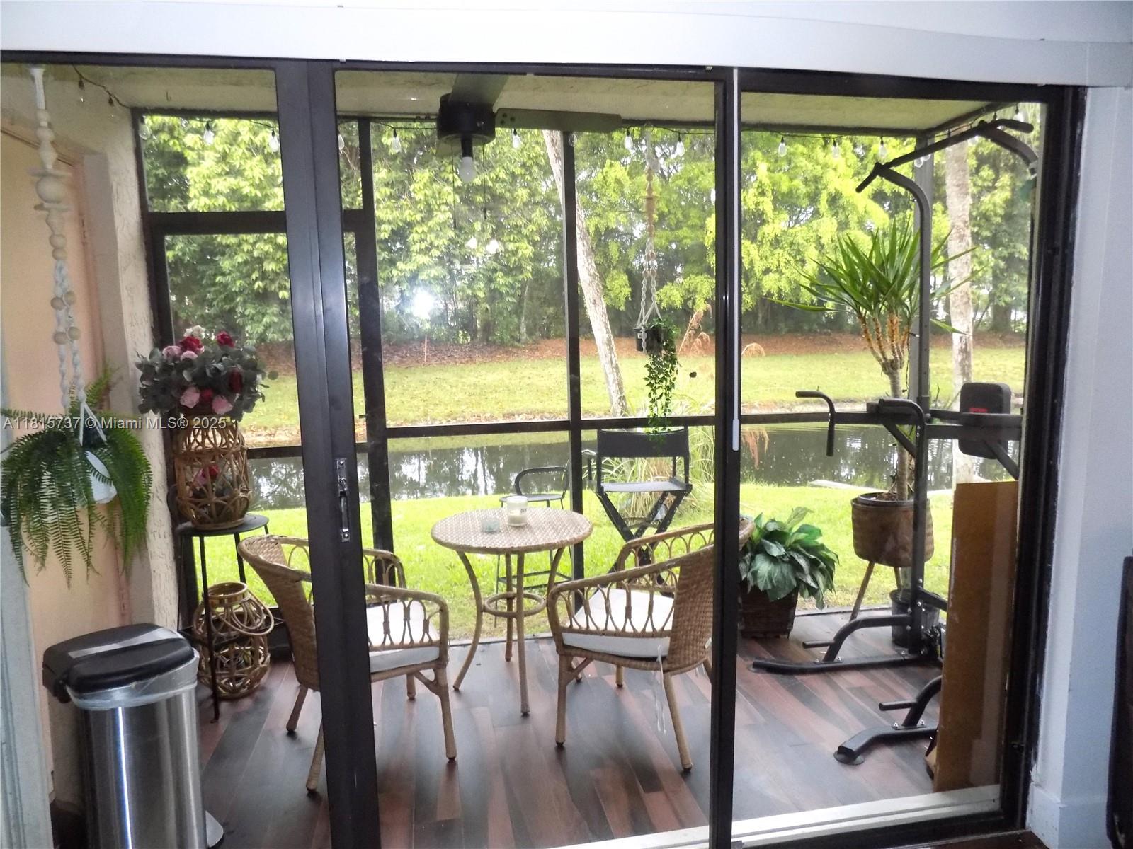 Bonaventure Weston, FL 33326 - Photo 8 of 16 a view of a room with furniture and floor to ceiling windows