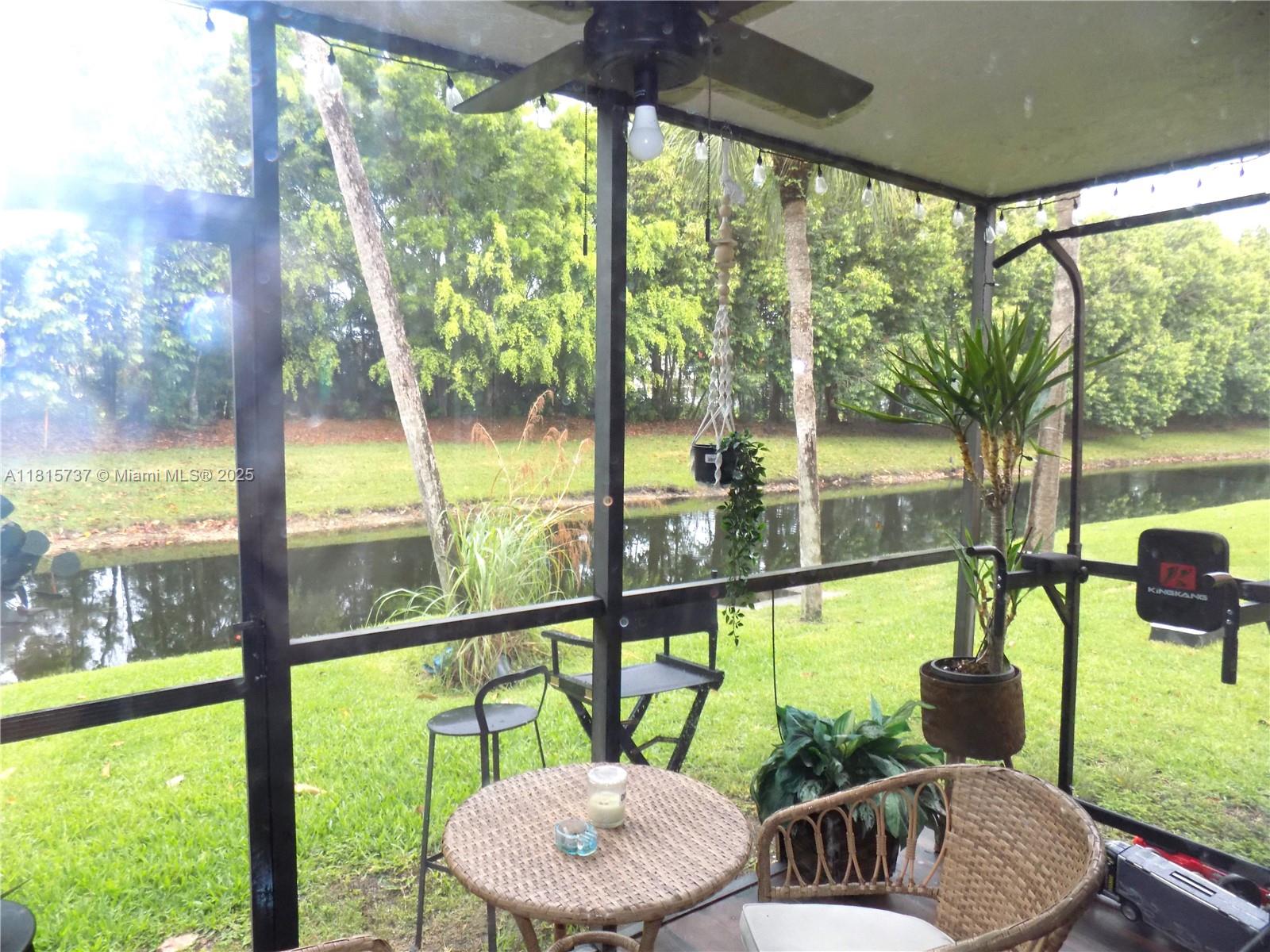 Bonaventure Weston, FL 33326 - Photo 9 of 16 a view of an outdoor dining room with furniture and floor to ceiling windows