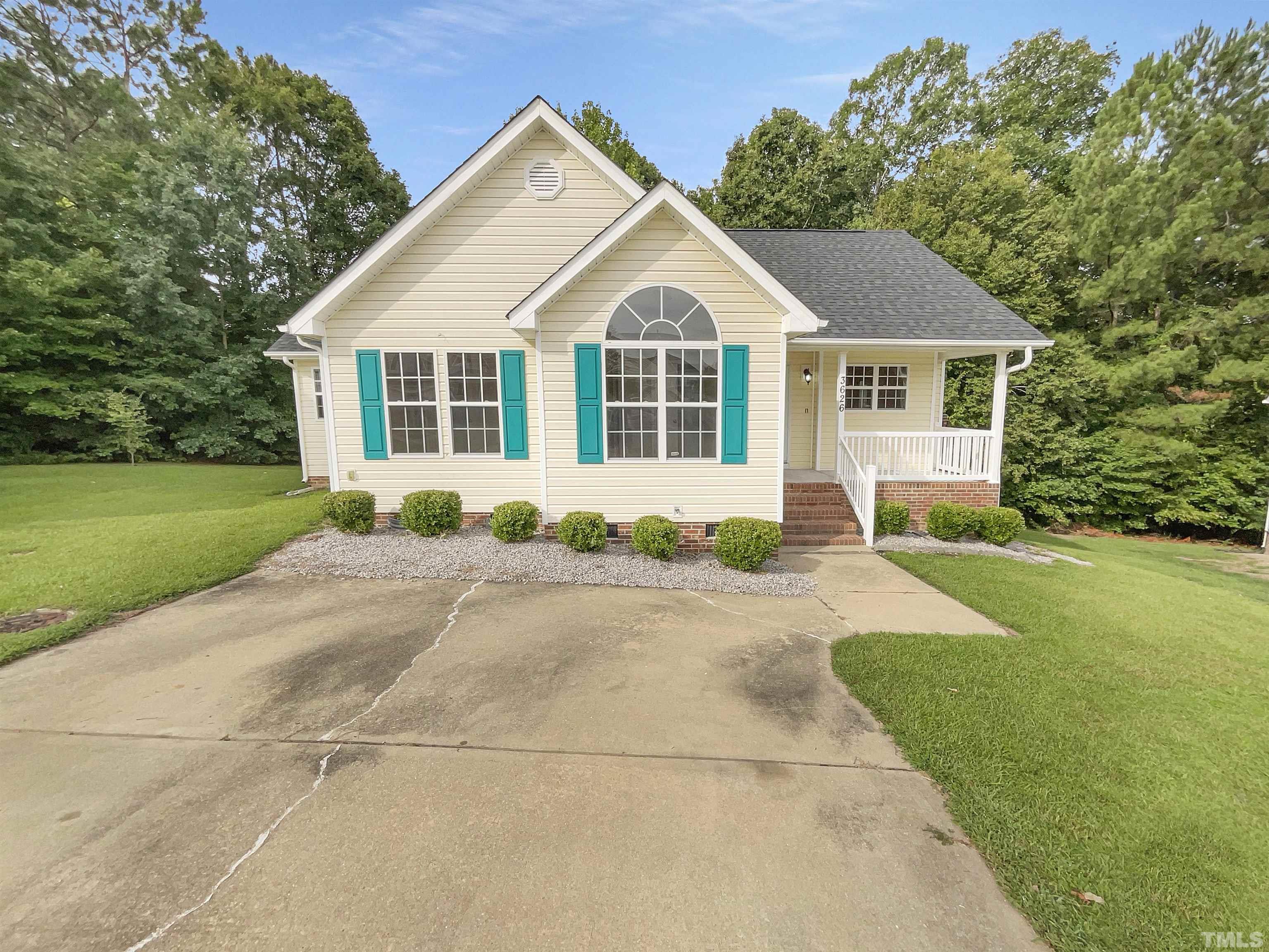 3626 Enduring Freedom Drive Raleigh, NC 27610 - Photo 1 of 17 a front view of a house with a garden