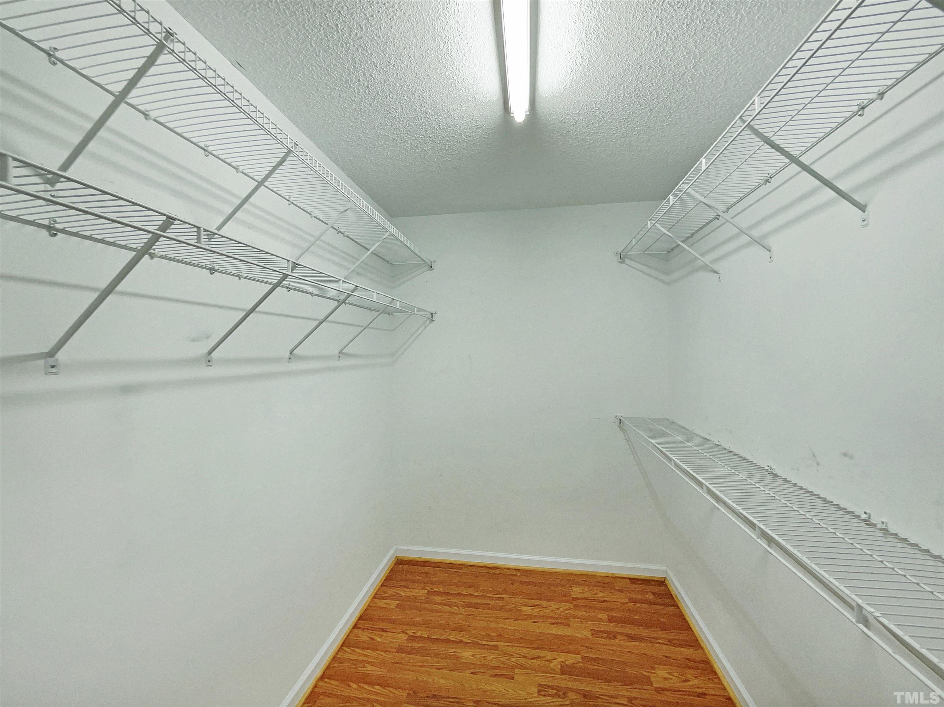 3626 Enduring Freedom Drive Raleigh, NC 27610 - Photo 15 of 17 a view of a room with racks on the wall