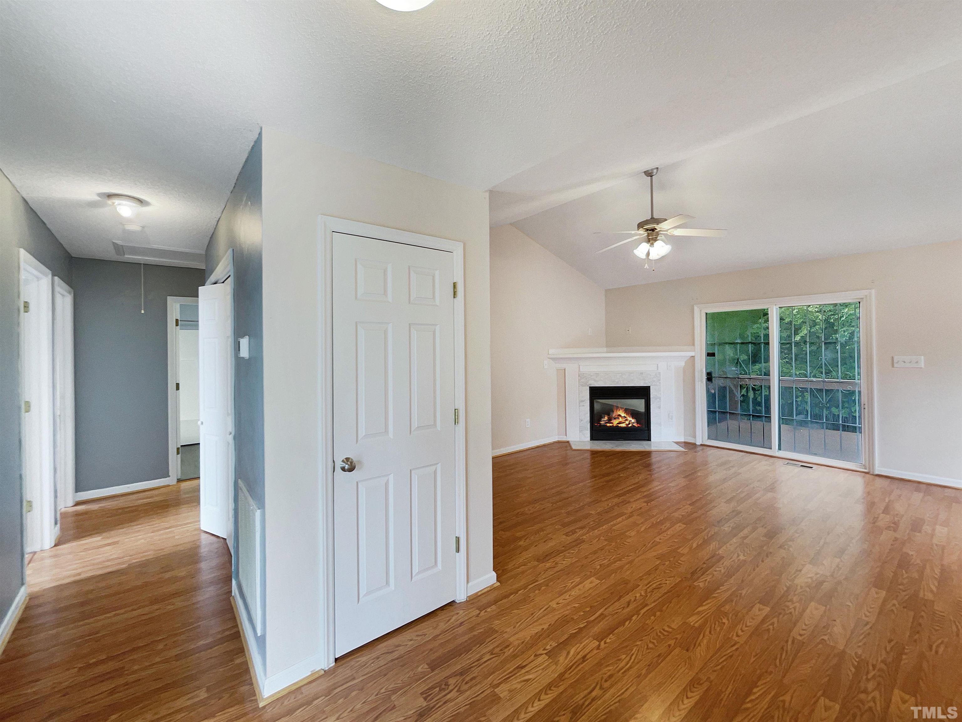 3626 Enduring Freedom Drive Raleigh, NC 27610 - Photo 6 of 17 a view of empty room with wooden floor and fireplace