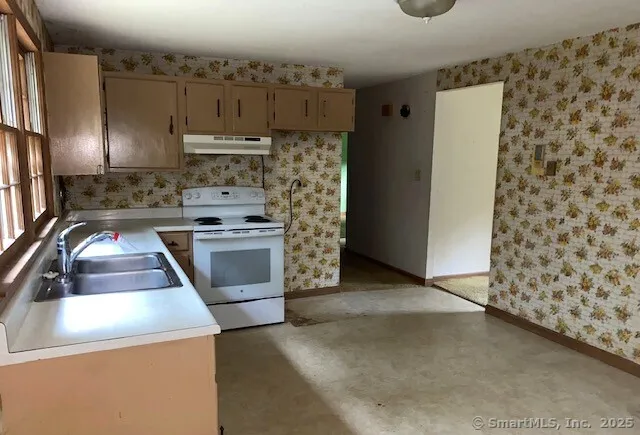 a kitchen with a stove a refrigerator and a stove