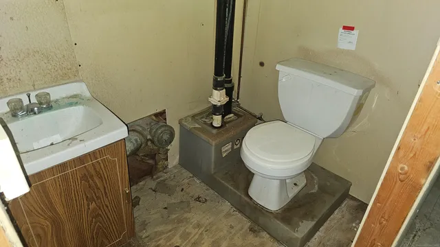 a bathroom with a toilet and a sink