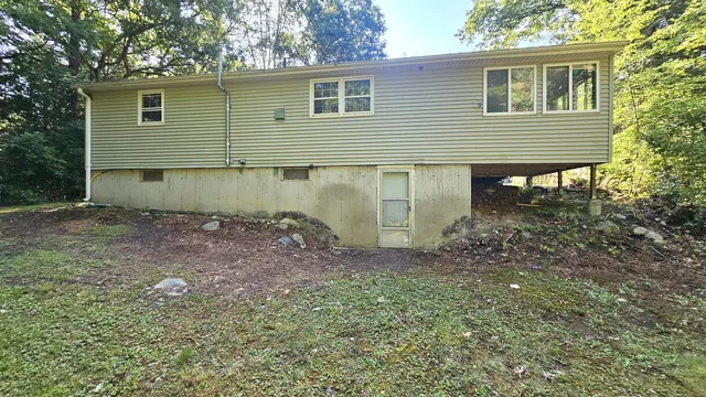 a backyard of a house with lots of green space