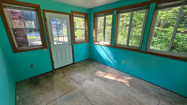a view of empty room with front door