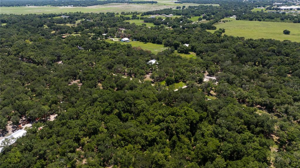 Southeast Brown Road Arcadia, FL 34266 - Photo 18 of 18 an aerial view of residential houses with outdoor space and trees