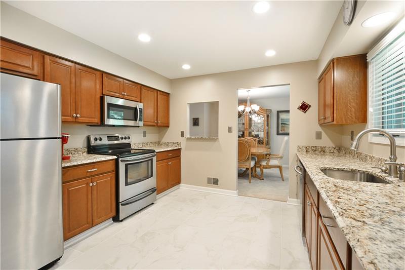 67 Forest Grove Road Coraopolis, PA 15108 - Photo 7 of 22 Cherry Cabinetry with Granite Countertops and recessed lighting