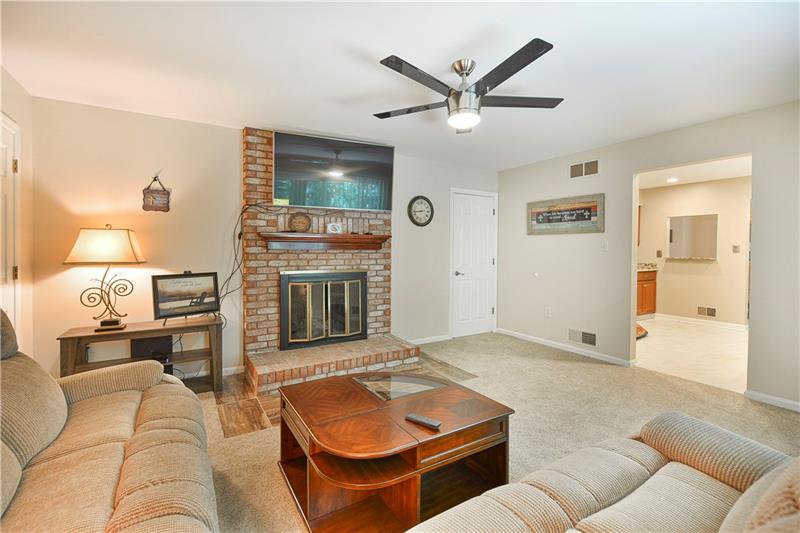 67 Forest Grove Road Coraopolis, PA 15108 - Photo 10 of 22 Family Room with Gas log Fireplace and mounted TV