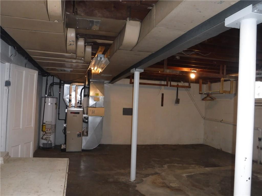 1425 Harvey Run Road Freedom, PA 15042 - Photo 18 of 25 Large basement good height, new concrete for new drains