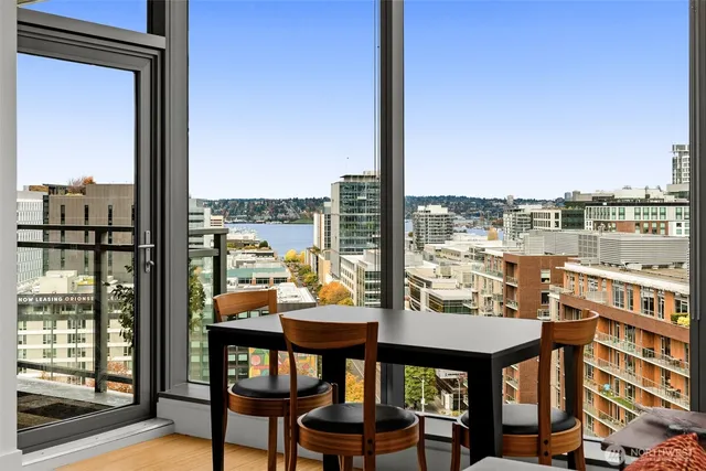 a room with furniture and a floor to ceiling window