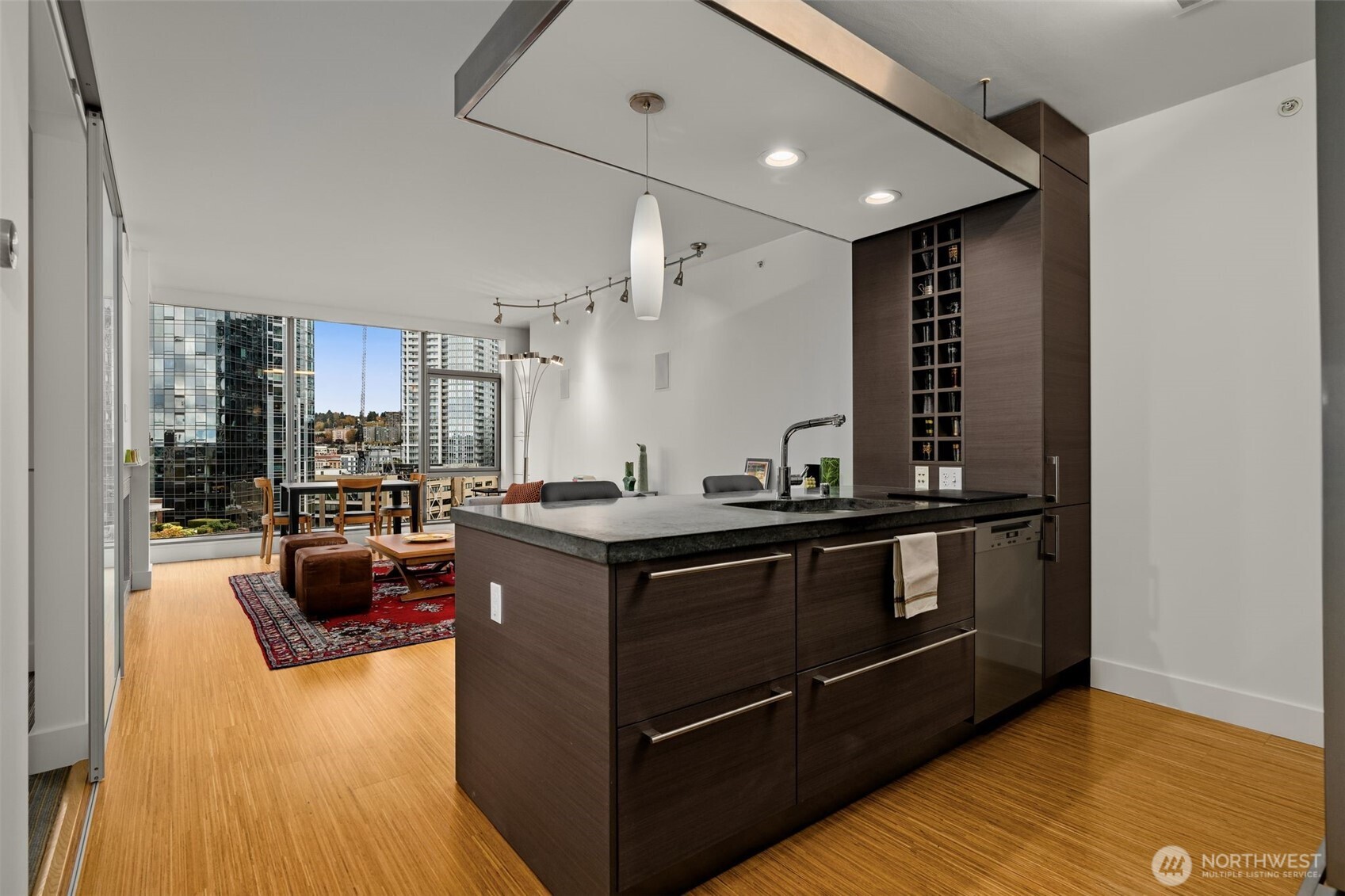 820 Blanchard Street, Unit 1301 Seattle, WA 98121 - Photo 11 of 29 a kitchen with stainless steel appliances granite countertop a stove and a sink