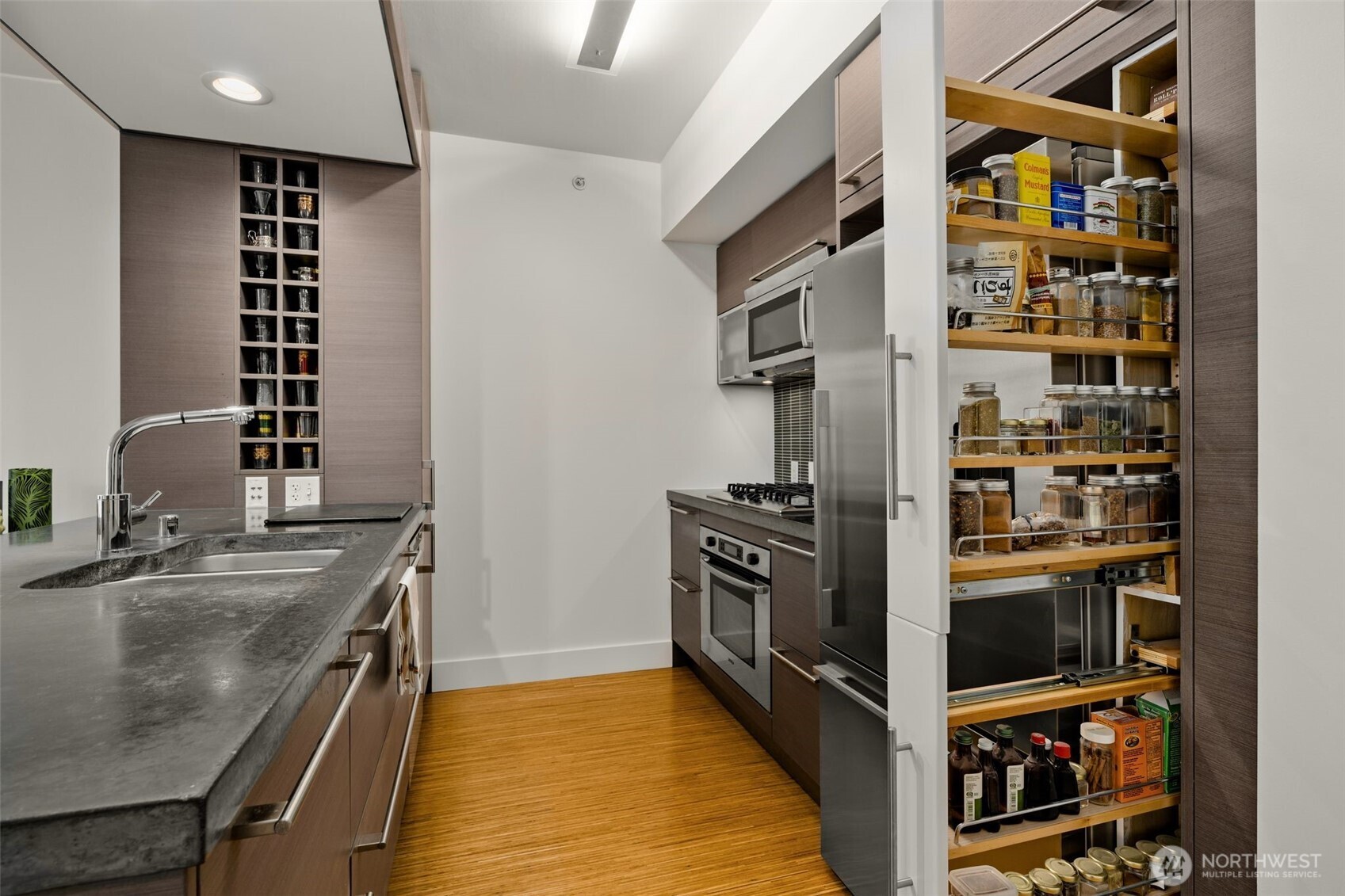 820 Blanchard Street, Unit 1301 Seattle, WA 98121 - Photo 13 of 29 a kitchen with stainless steel appliances granite countertop a refrigerator and a sink