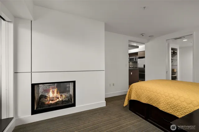 a bedroom with a bed and a fireplace