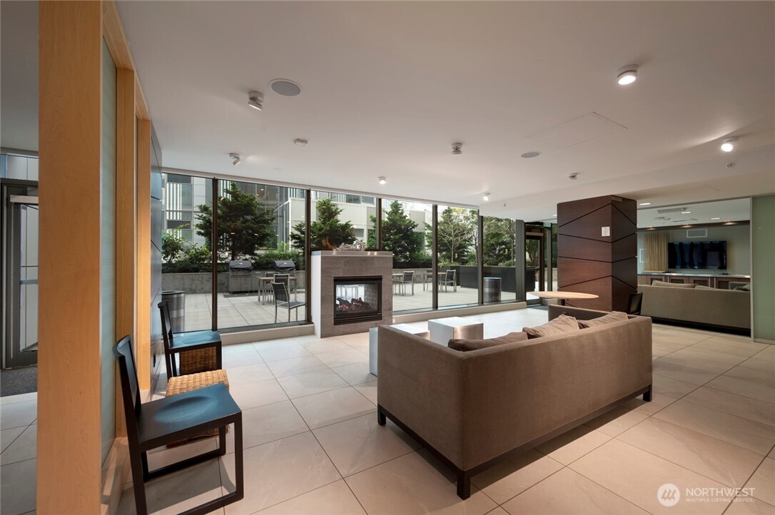 820 Blanchard Street, Unit 1301 Seattle, WA 98121 - Photo 22 of 29 a living room with furniture and a flat screen tv
