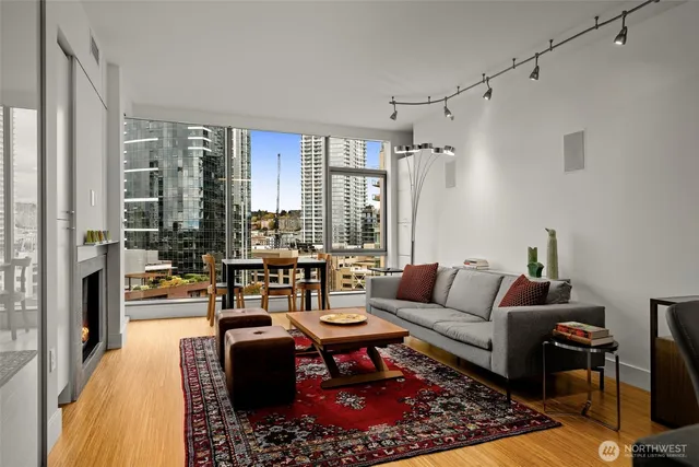 a living room with furniture fireplace and a table