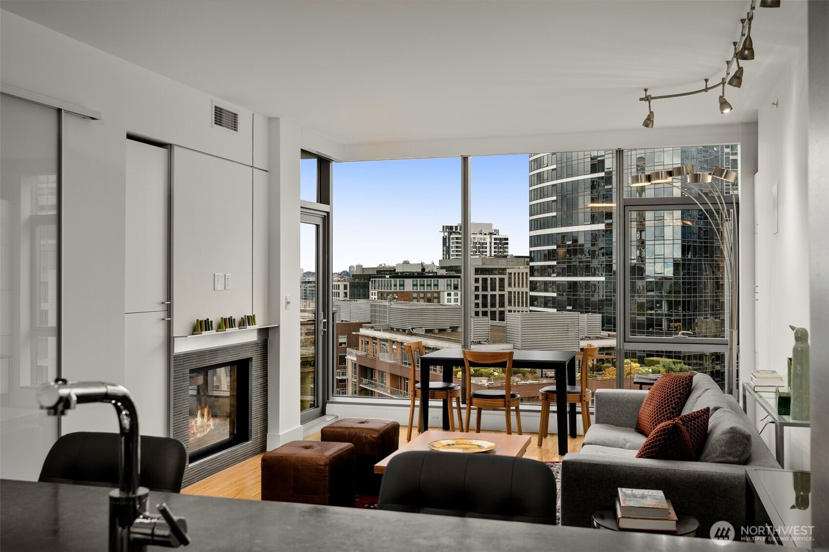 820 Blanchard Street, Unit 1301 Seattle, WA 98121 - Photo 8 of 29 a living room with furniture and a fireplace