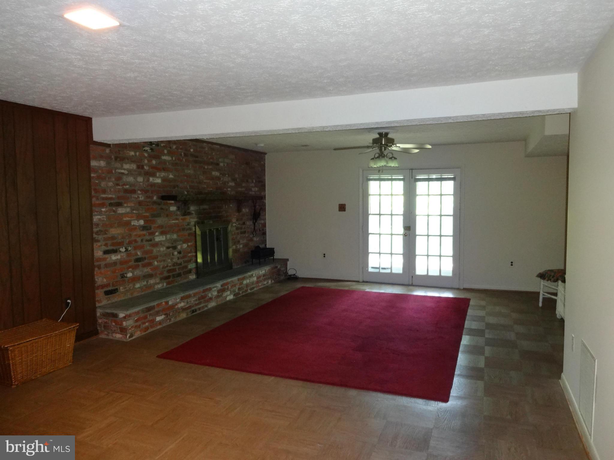 8404 Rambler Drive Adelphi, MD 20783 - Photo 18 of 26 Recreation Room w/Fireplace and French Doors