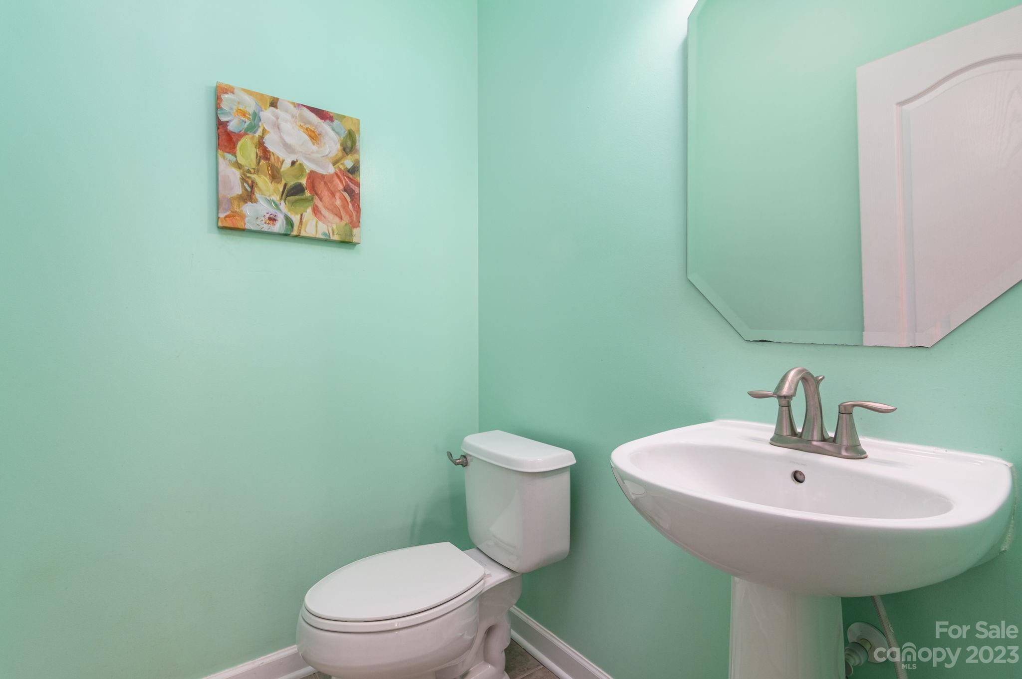 582 Evening Mist Drive Fort Mill, SC 29708 - Photo 12 of 31 a bathroom with a toilet a sink and mirror