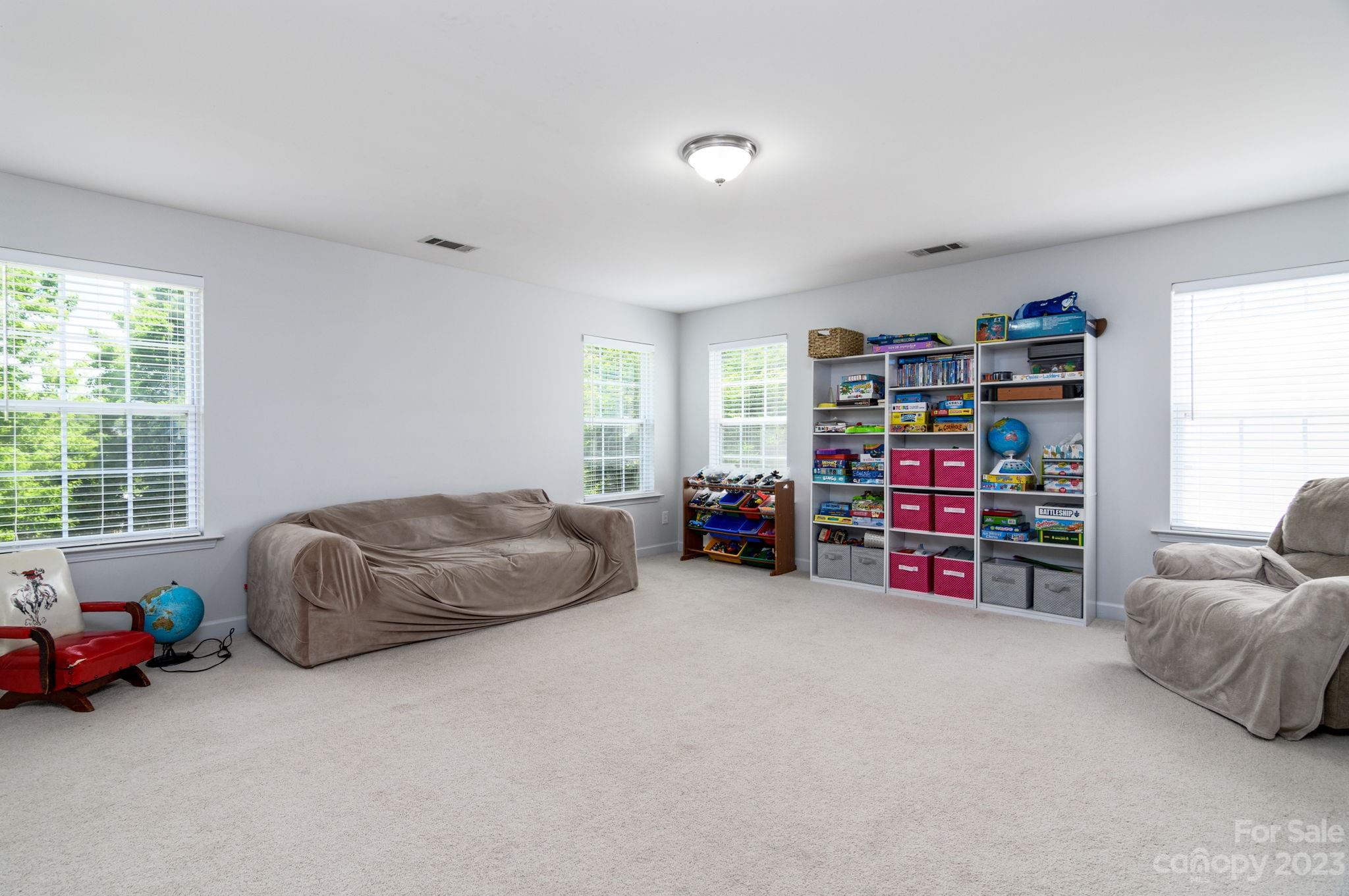 582 Evening Mist Drive Fort Mill, SC 29708 - Photo 16 of 31 a bedroom with furniture and a large window