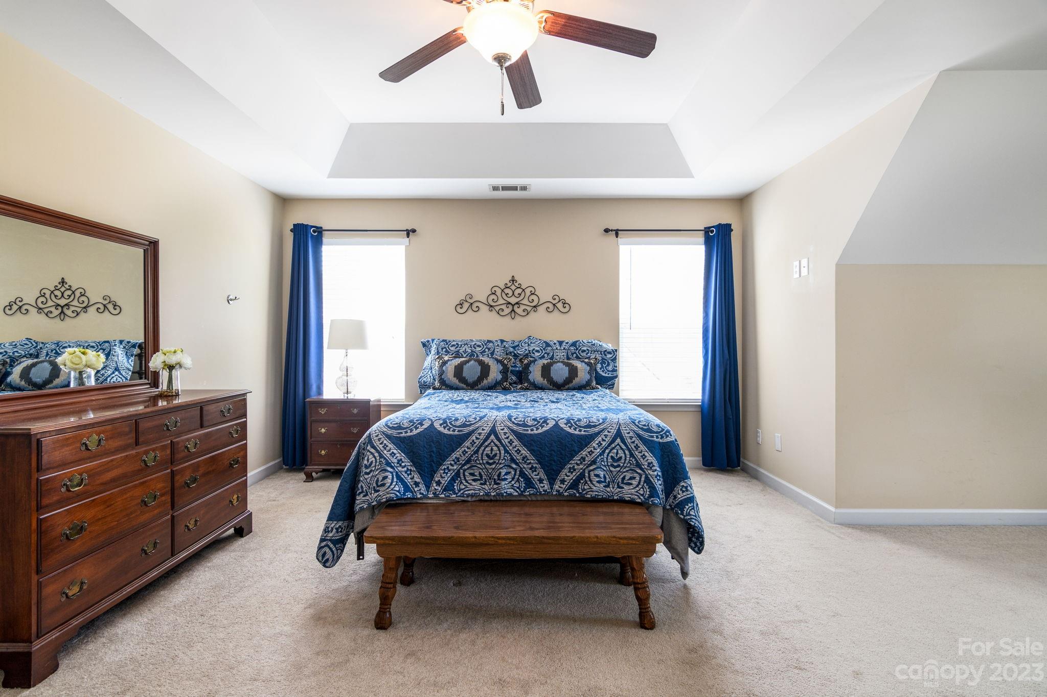 582 Evening Mist Drive Fort Mill, SC 29708 - Photo 18 of 31 a bedroom with a bed and dresser