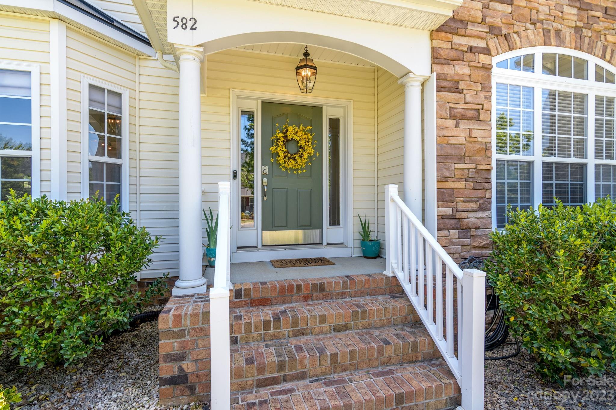 582 Evening Mist Drive Fort Mill, SC 29708 - Photo 2 of 31 a view of a entrance with stairs